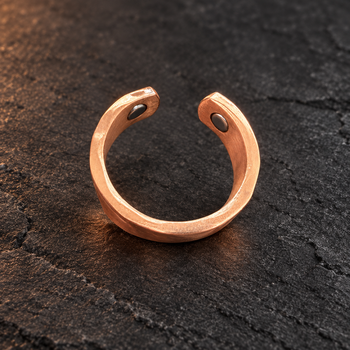 Adjustable copper ring showing two neodymium magnets