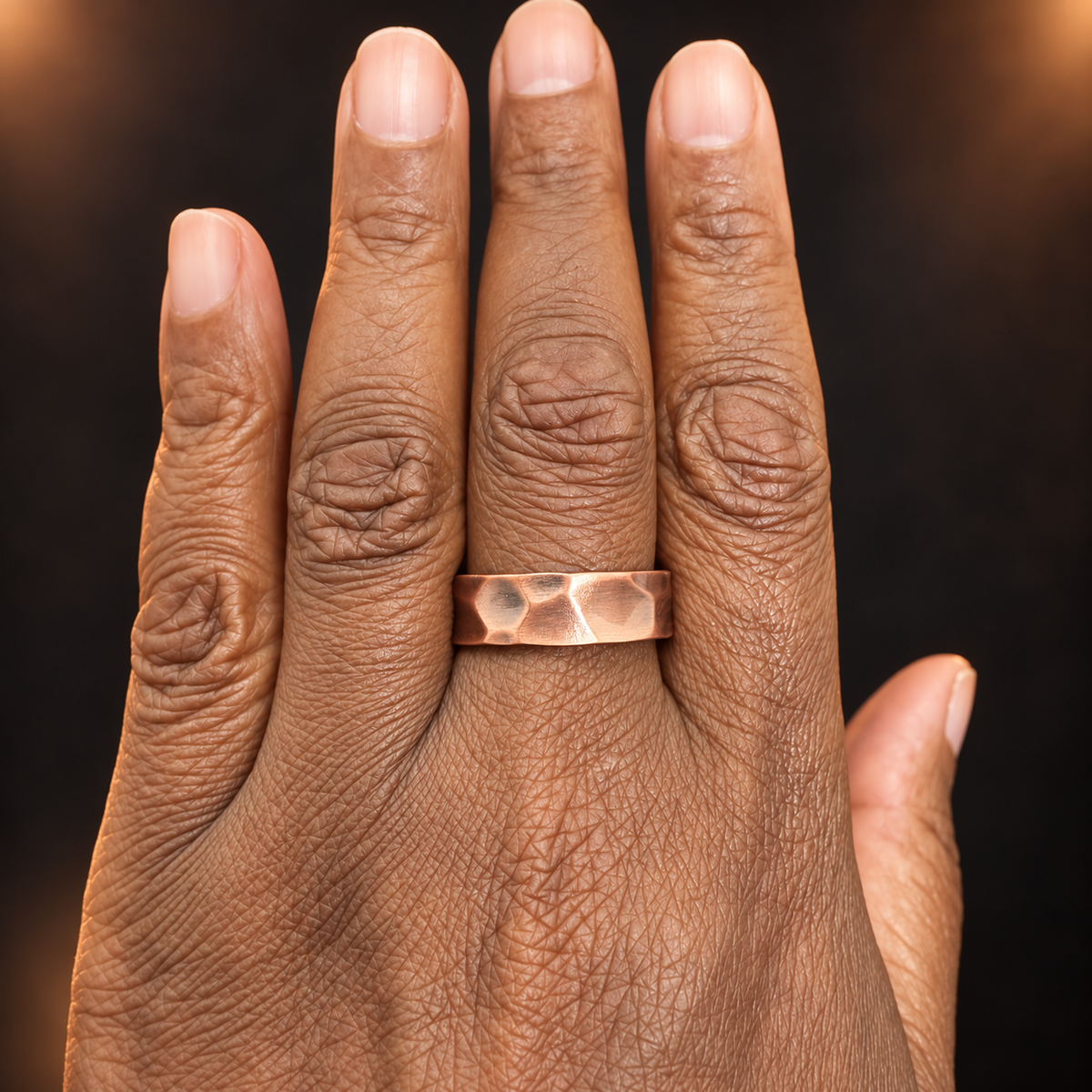Earthforged hammered copper ring worn on hand