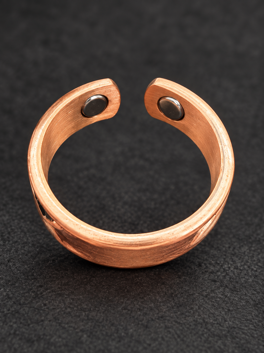 Pisces copper ring showing two neodymium magnets