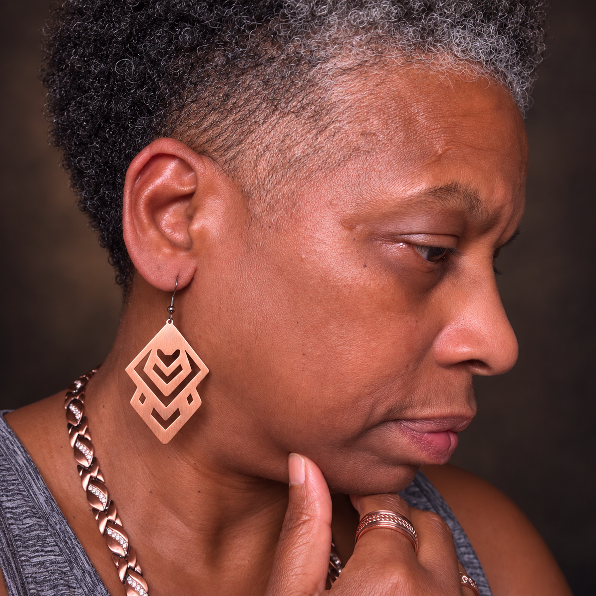 Sha wearing pure copper geometric drop earrings