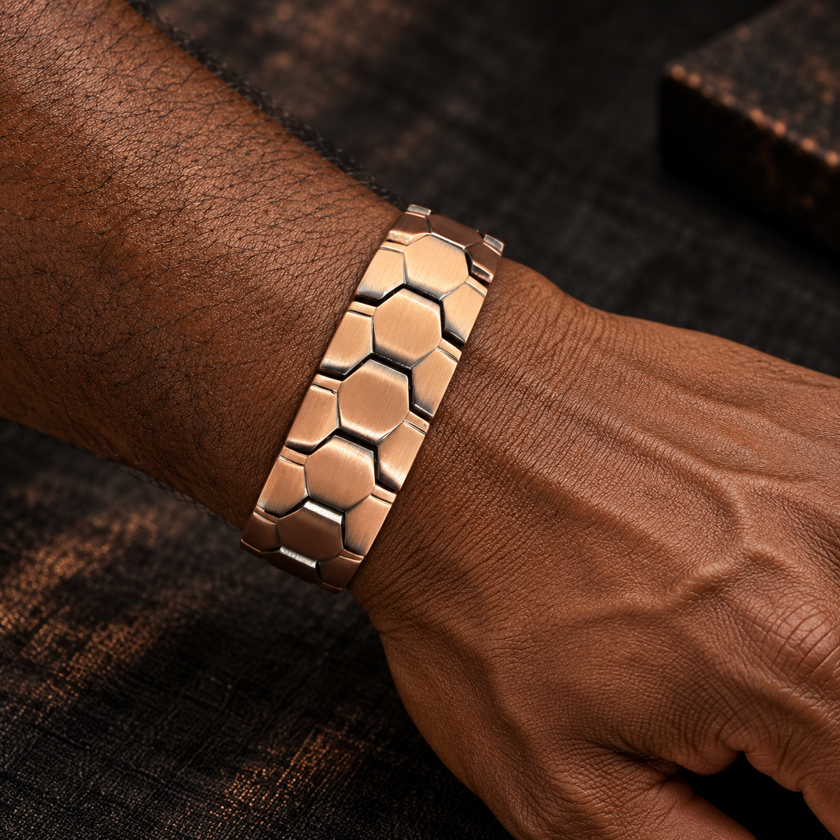 Close-up of Sacred Armor copper magnetic bracelet on a man's wrist