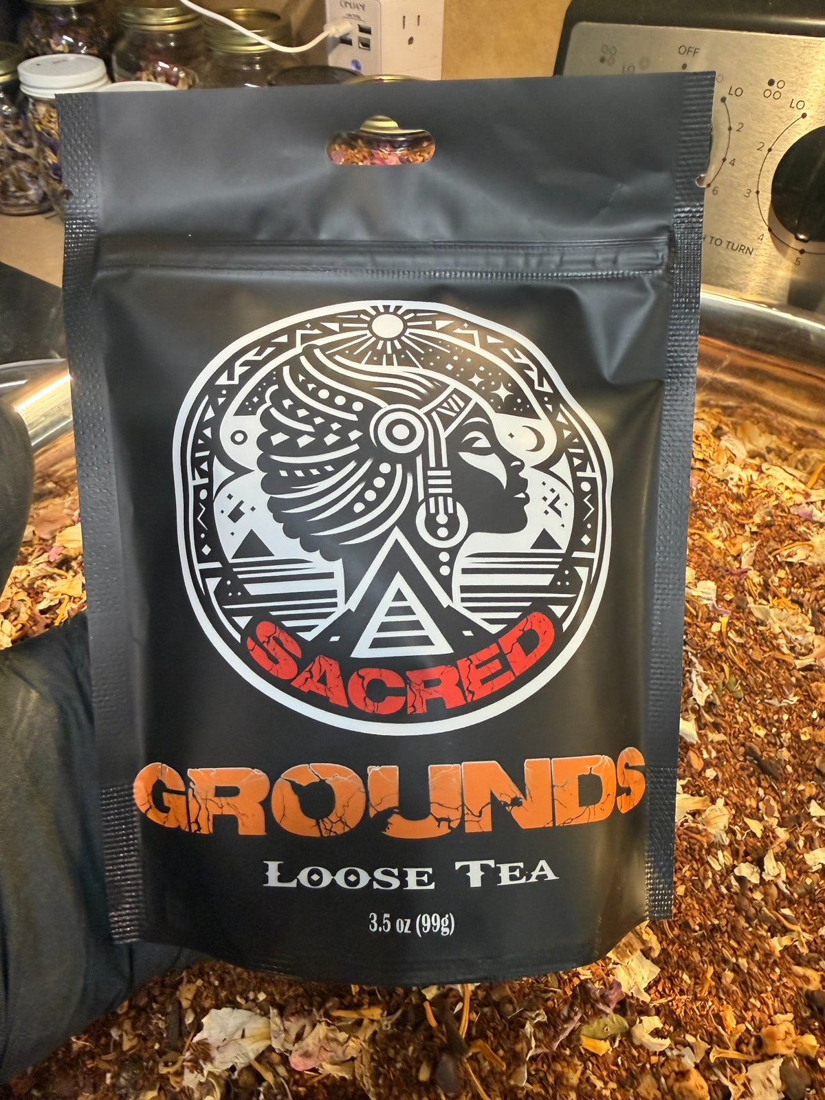 Sacred Grounds loose tea in a 3.5 ounce black resealable pouch