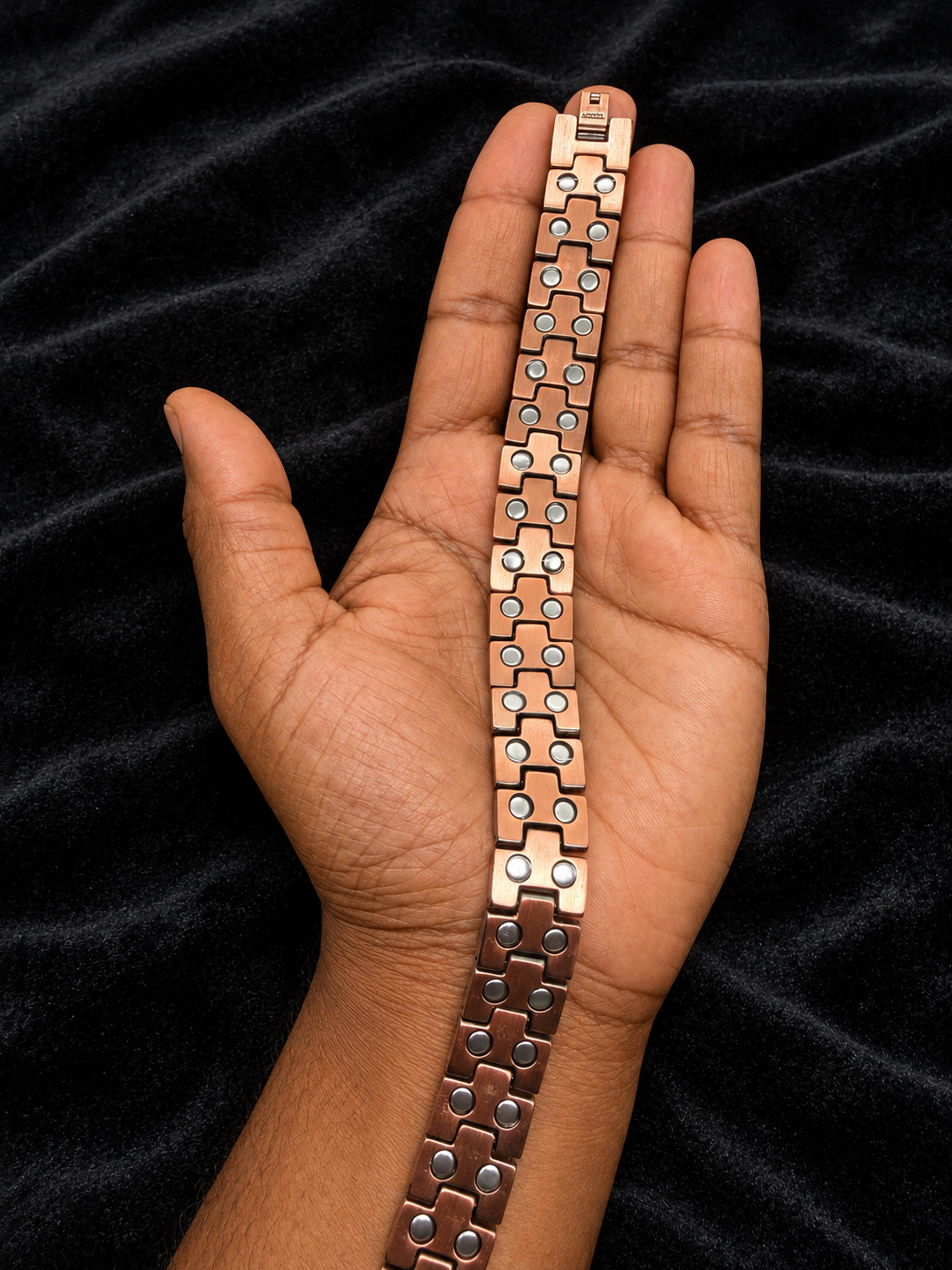 Copper back of bracelet with paired neodymium magnets