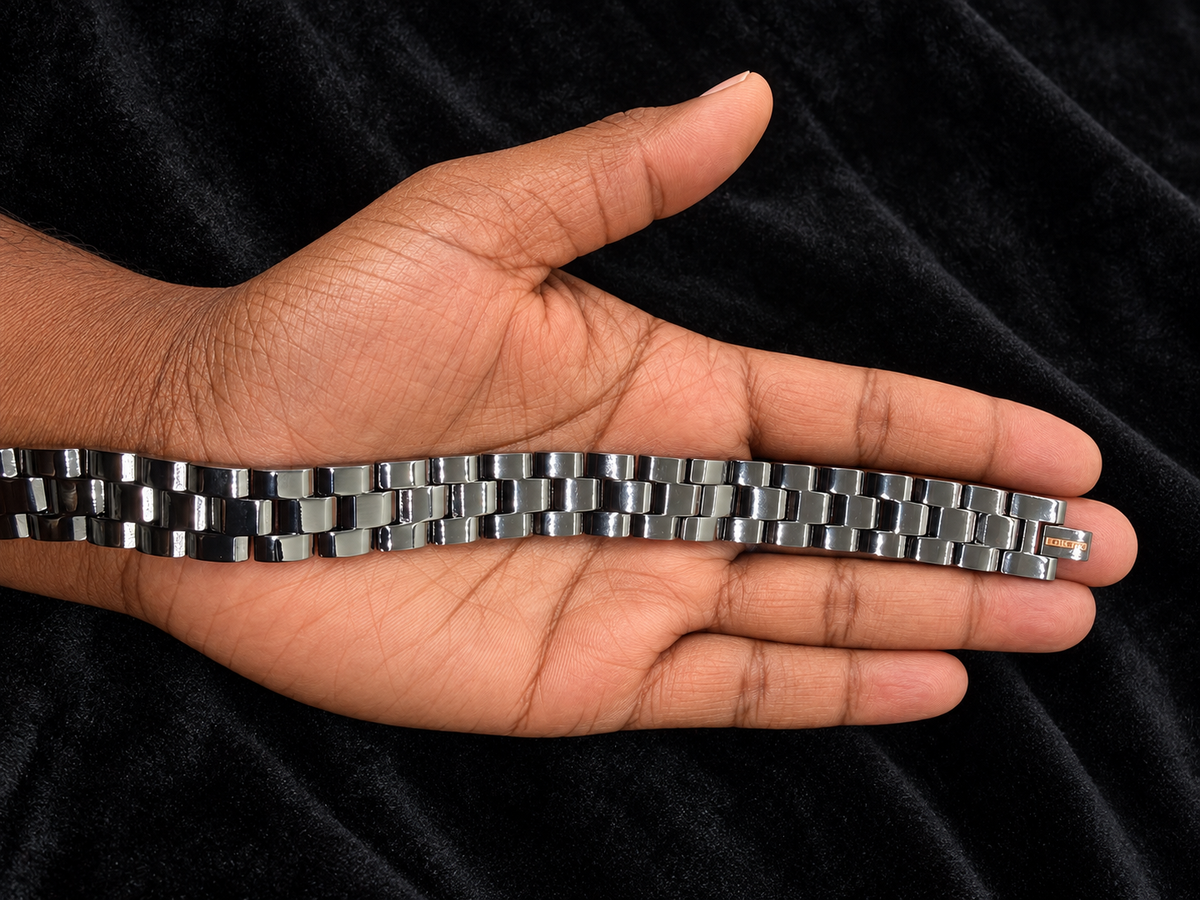 Black link bracelet displayed on a masculine hand