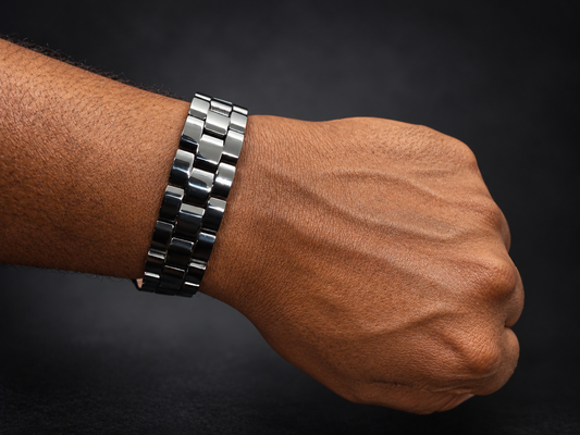 Black linked magnetic bracelet worn on a masculine wrist