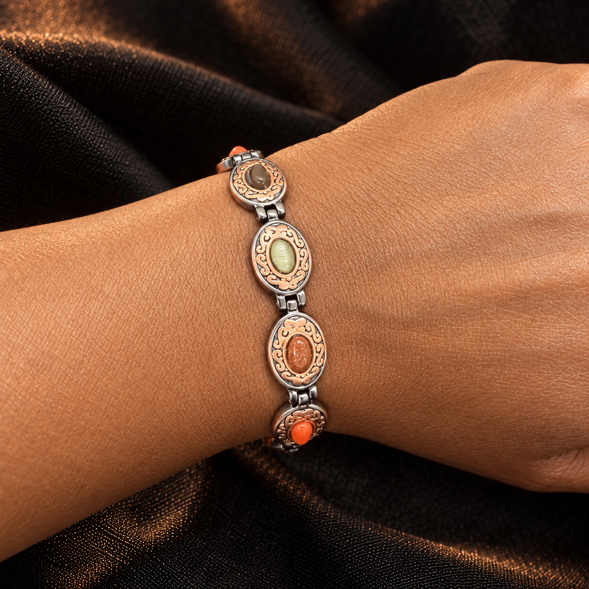 The Oval Multi Stone copper magnetic bracelet worn on wrist